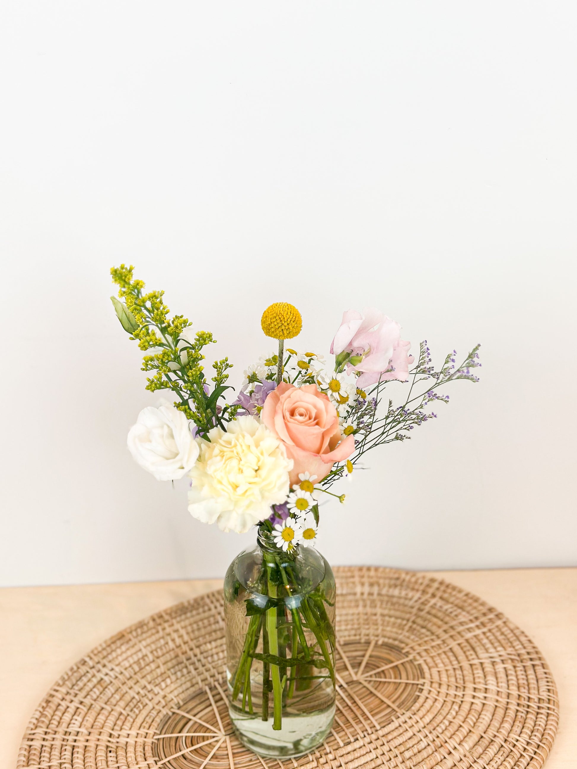fresh flowers arrangement in a clear vase.