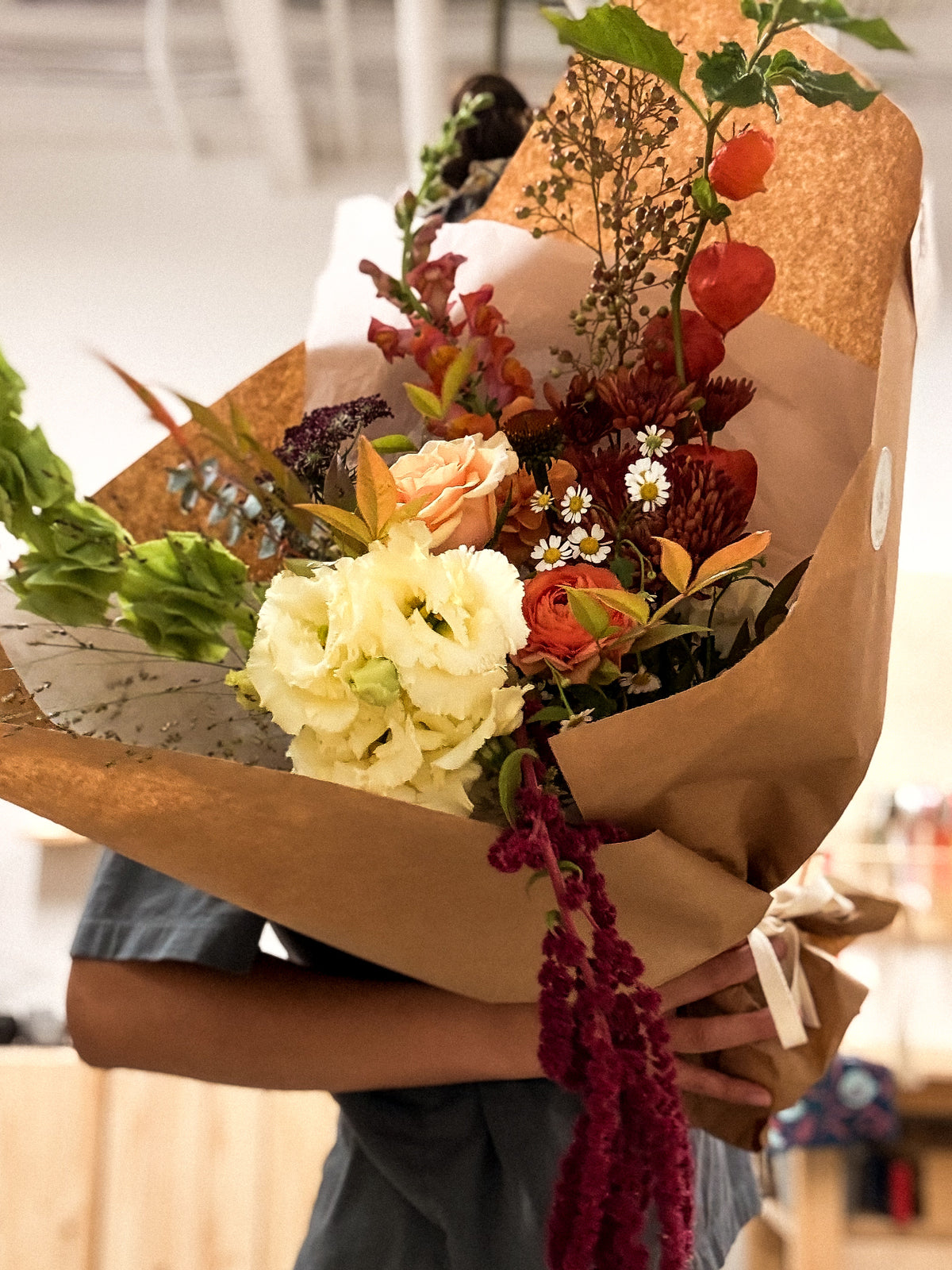 The Autumn Signature hand-tied autumn bouquet featuring seasonal blooms and warm fall colours